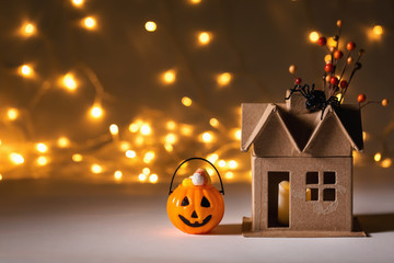 Halloween pumpkin with spider on a shiny light background