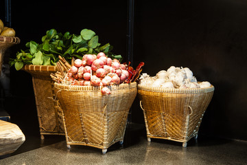 The white garlic onion in basket for restaurant decor