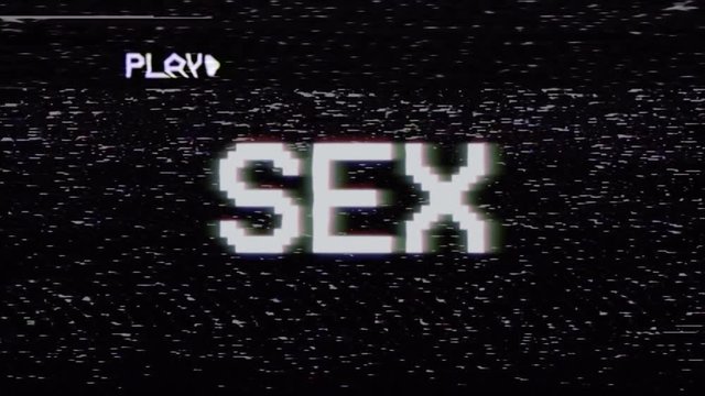 Fake VHS tape recording: the text Sex, appearing with RGB distortion.
