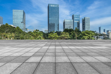 Panoramic skyline and buildings with empty square floor.