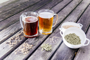 Glass of a tasty home made beer on table