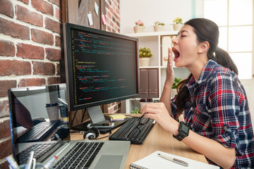 Fototapeta na wymiar female programmer overworking and yawing
