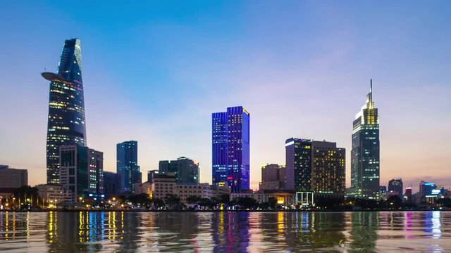 Timelapse or time lapse is fast video. Timelapse landscape sunrise to morning of Ho Chi Minh city or Sai Gon, Vietnam. Royalty high quality free stock footage time lapse of center city in dawn sky