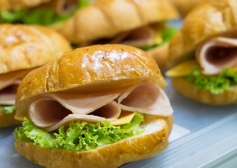 close up Croissant with ham and cheese for breakfast in the morning