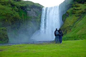 Skógafoss with people