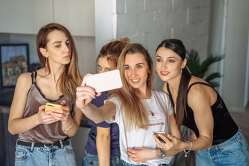 girls take selfy on the phone