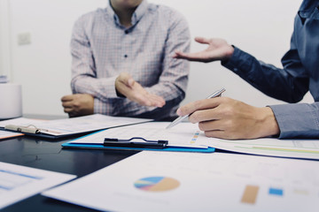 Images of the two businessmen working together in the Office.