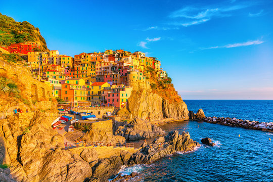 Europe travel luxury Italy destination - Cinque Terre famous hiking trail leading to old towns over the ocean on coastline. Popular tourist european destination.