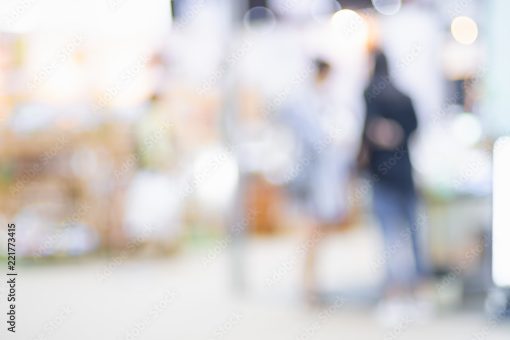 Poster blurred background crowd of people shopping in event expo trade fair with bokeh light.