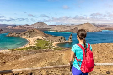 Foto op Canvas Galapagos islands cruise vacation tourist woman at Bartolome or Bartholomew island view on hiking shore excursion. Hiker Ecuador tourism. © Maridav