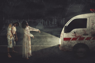 Two creepy zombies hindering an ambulance car