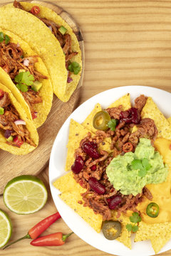 Overhead photo of Mexican tacos and nachos with copy space