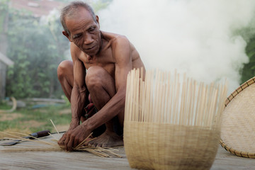 Old man and baskets.