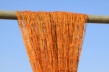 Suspension of fishing nets in the blue sky