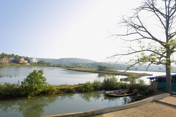 Small canoe on Arpora river. Bardez, Goa, India