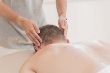 Fototapeta na wymiar Masseur hands making relax masage.Massage therapy.Close up