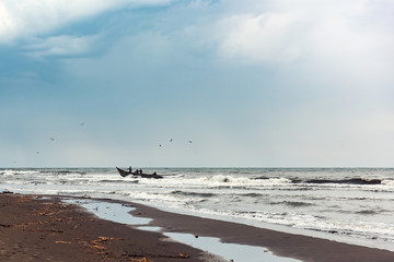 Fishermens on a boat in the sea