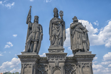 Fototapeta na wymiar Sculptures Charles Bridge. Statues of three figures - Saint Norbert, St. Vaclav and St. Sigismund. Prague Czech Republic