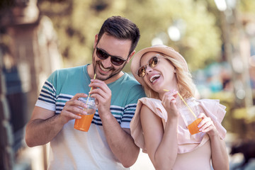 Young couple drinking healthy juice