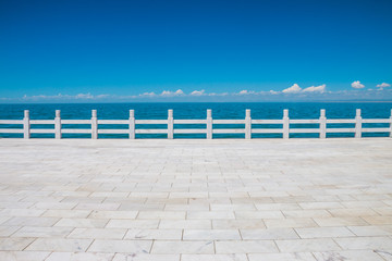 Sidewalk ground and Qinghai Lake, China © daizuoxin