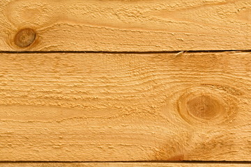 The texture of the surface of pine boards.
