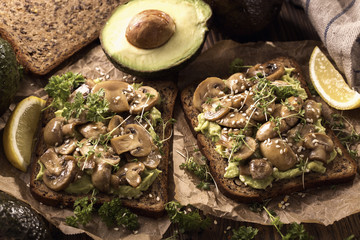 Bread with avocado spread and champignons