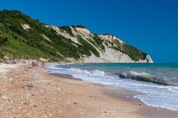 Fototapeta na wymiar The Mezzavalle beach in the Conero area near Ancona during the summer