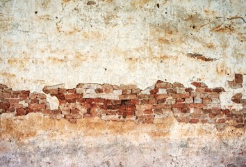 Old white wall cracked red brick surface background