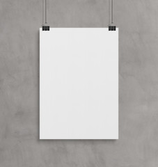 Blank white poster hanging up with clips mockup