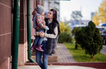 Fototapeta premium Mom and daughter on the doorstep of the house