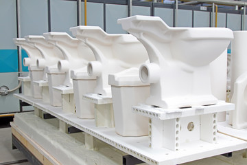 Fototapeta na wymiar Ceramic toilet products in a workshop