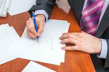Businessman signs documents