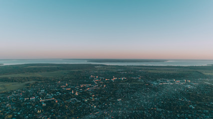 Obraz premium Aerial view of the village. Building. Field. Sunset. River. Sky. Ukraine.