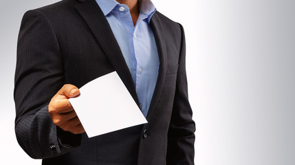 Management submits an envelope to employees.