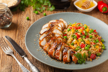 Grilled chicken breast in teriyaki sauce. Served with brown rice and vegetables.