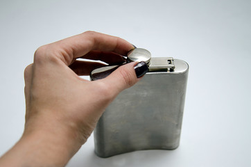 iron flask under a liquor on a white background