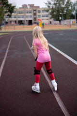active lifestyle in a modern city - active lifestyle in a modern city - stylish girl roller-blading...