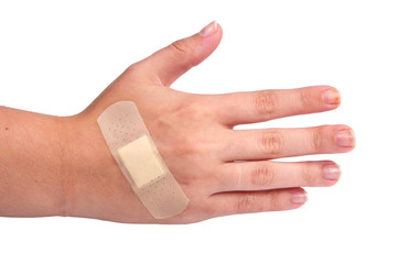 Naklejka premium medical plaster or patch on hand isolated on the white