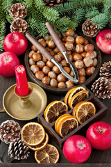 Christmas still life with apples, nuts and candle