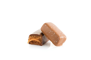 chocolate candy with salted caramel  isolated on white