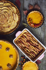 Autumn background. Homemade Pumpkin, apple Pies for Thanksgiving Ready to Eat.