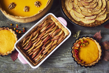 Autumn background. Homemade Pumpkin, apple Pies for Thanksgiving Ready to Eat.