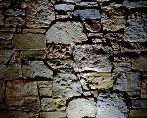illuminated stone wall background, space for typing