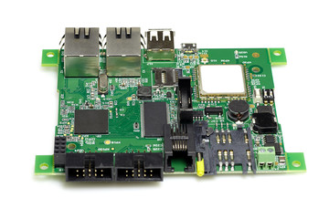 Electronic printed green circuit board with chips and other components, isolated on white background