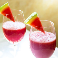 Watermelon cocktail in a glass with a slice of watermelon for decoration. Summer fruit cooling healthy drink