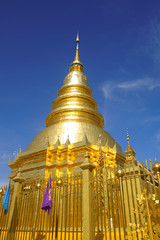 Fototapeta premium Golden pagoda with beautiful blue sky and respected people.