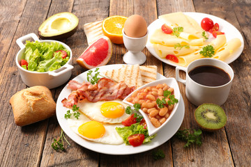 breakfast with egg, bean, toast and coffee