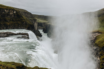 scenic view of steam above waterfall on beautiful Gullfoss waterfall in Iceland