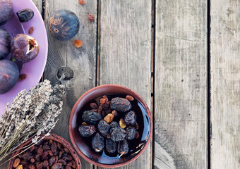 Figs on ceramic plate on wooden table background