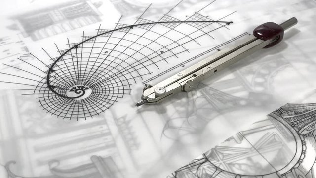 workplace of the architect: architectural drawings - blueprints and compass smoothly rotate on the surface of the architectural plan of a modern house